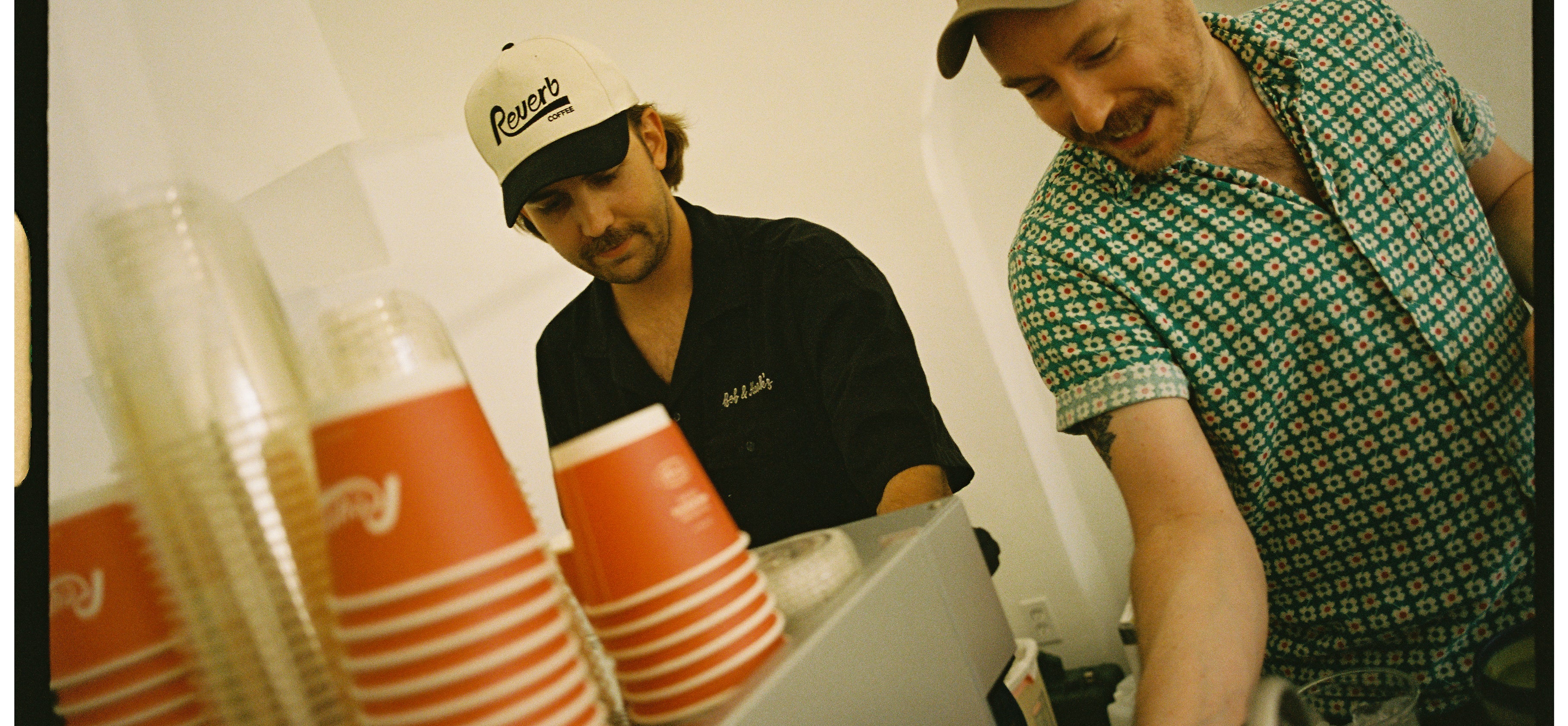 Two baristas preparing specialty coffee
