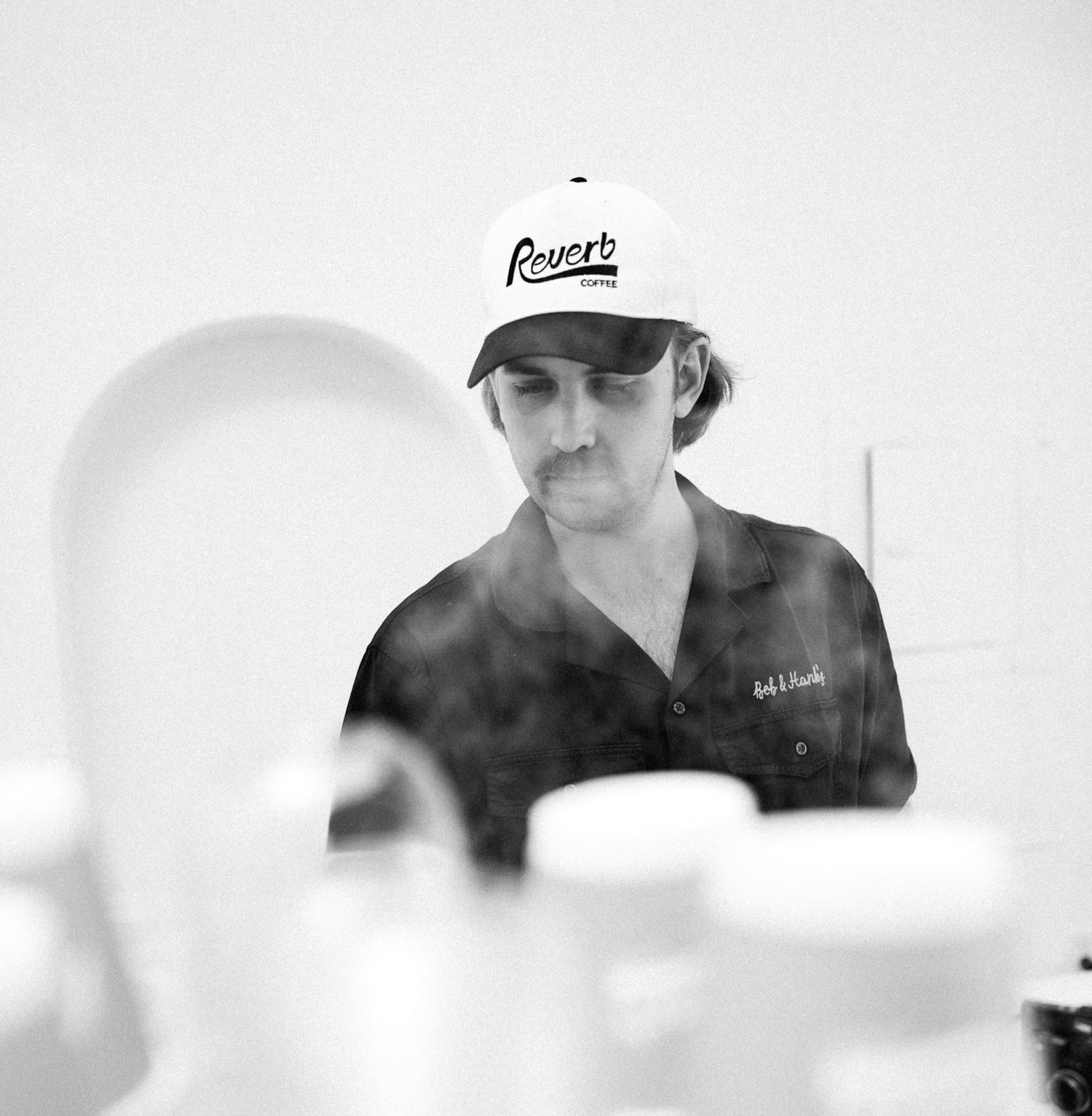 Barista serving specialty coffee